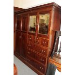 A early 20th century mahogany and satinwood banded combination wardrobe