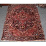 Saroukh rug, the field of angular vines and a tomato red medallion enclosed by meandering vine