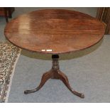 A George III oak tilt-top tripod table