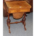 A Victorian figured walnut games and sewing table