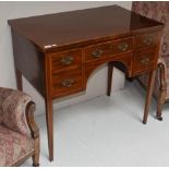 An inlaid mahogany dressing/writing table on four tapering square-section legs
