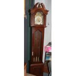 A reproduction Westminster chiming longcase clock, with three brass weights