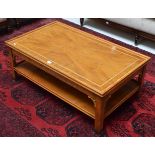 A reproduction rectangular two-tier coffee table
