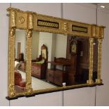 A gilt framed sectional over mantel mirror