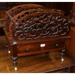 An early Victorian rosewood four-division Canterbury, with turned spindles, scrolled fret work and