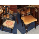 An 18th century joined oak corner chair, the carved back with solid splat above outswept arms and