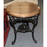 A cast iron Britannia pub table with circular moulded top