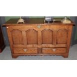 A George III oak four panel mule chest