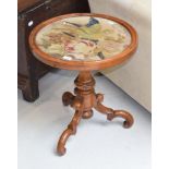 A Victorian mahogany circular tripod table with wool work panel, together with a 19th century