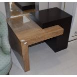 A modern travertine and ebonised side table, retailed by Barker & Stonehouse, 85cm wide
