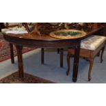 A mahogany Chippendale style D-end dining table, the two end sections with drop leaves above a