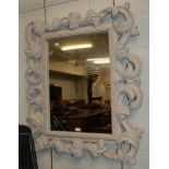 A reproduction white painted decorative mirror