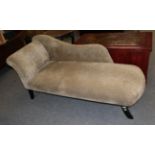 A chaise longue, with fabric covering in a shabby style