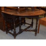 An oak gateleg table