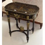 A 19th century French ebonised and inlaid parcel gilt metal mounted occasional table, fitted with
