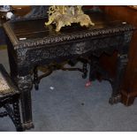 A 19th century carved oak side table