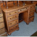 A Victorian mahogany kneehole desk