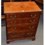 A reproduction mahogany chest of drawers