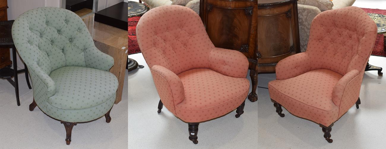 A pair of Victorian mahogany framed button back tub chairs upholstered in contrasting pink and green