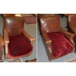 A pair of early 20th century club armchairs, upholstered in brown close-nailed leather