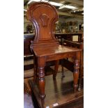 A Victorian carved mahogany hall chair