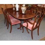 A walnut dining table together with a set of six chairs (7)