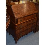 A 1930s burr walnut bureau