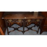 A 1920s oak two drawer table in the 17th century style