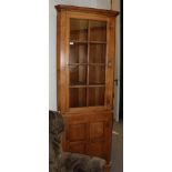 A well made Georgian style oak glazed and panelled standing corner cupboard (en suite to previous