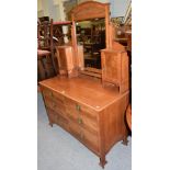 An Arts & Crafts walnut and ebony strung dressing chest