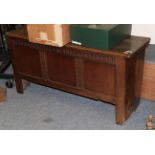 An early 18th century oak chest with mulled frieze