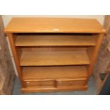 A reproduction oak bookcase, the base with two drawers