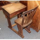 An oak and elm school room desk with integral chair, together with an oak bureau (2)