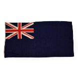 A British Blue Ensign, made-up of stitched linen panels, the cream hoist stencilled 4 YD ENSIGN,