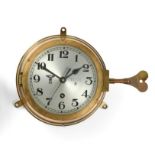 A German Third Reich Kriegsmarine Bulk Head Clock, in a brass drum case, the 14.5cm circular