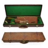 An Early 20th Century Crushed Leather Shotgun Case, with brass lock, the green baize lined