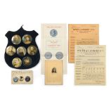 A Blue Velvet Shop Display Shield, set with seven large celluloid photographic button badges