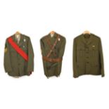 The Royal Marines: three No.5 Dress Uniforms:- to a Sergeant comprising a lovat green tunic with