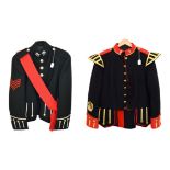 A Black Watch Piper's Blue Doublet, with red collar, shoulder tabs, cuffs and piping, staybrite