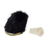 A British Guards Regiments Other Ranks Bearskin Cap, of black synthetic fur, with wicker frame,