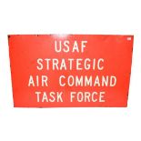 A USAAF Strategic Air Command Task Force Red Enamelled Tin Sign, with applied white lettering, the