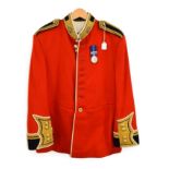 An Elizabeth II Officer's Scarlet Home Service Dress Tunic to the Coldstream Guards, with black