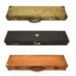 A Later 20th Century Leather Shotgun Case, bound with brass, with wood carcass, the maroon baize
