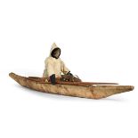 An Early 20th Century Inuit Model One Man Kayak, the wood frame covered in stretched scraped seal
