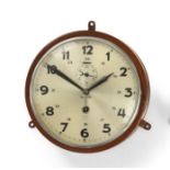 A German Third Reich Kriegsmarine Bulk Head Clock, in a brown painted sheet brass drum case, the