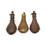 Three 19th Century Copper Powder Flasks, one by G & J W Hawksley embossed with netting, the brass