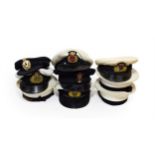 Three Elizabeth II Royal Navy Peaked Caps, each with raised bullion thread embroidered badge,