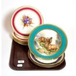 A set of five Royal Worcester floral painted dessert plates with red borders, a pair of blue and