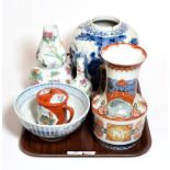 A Chinese ginger jar, Oriental vases, cups, bowl and figure