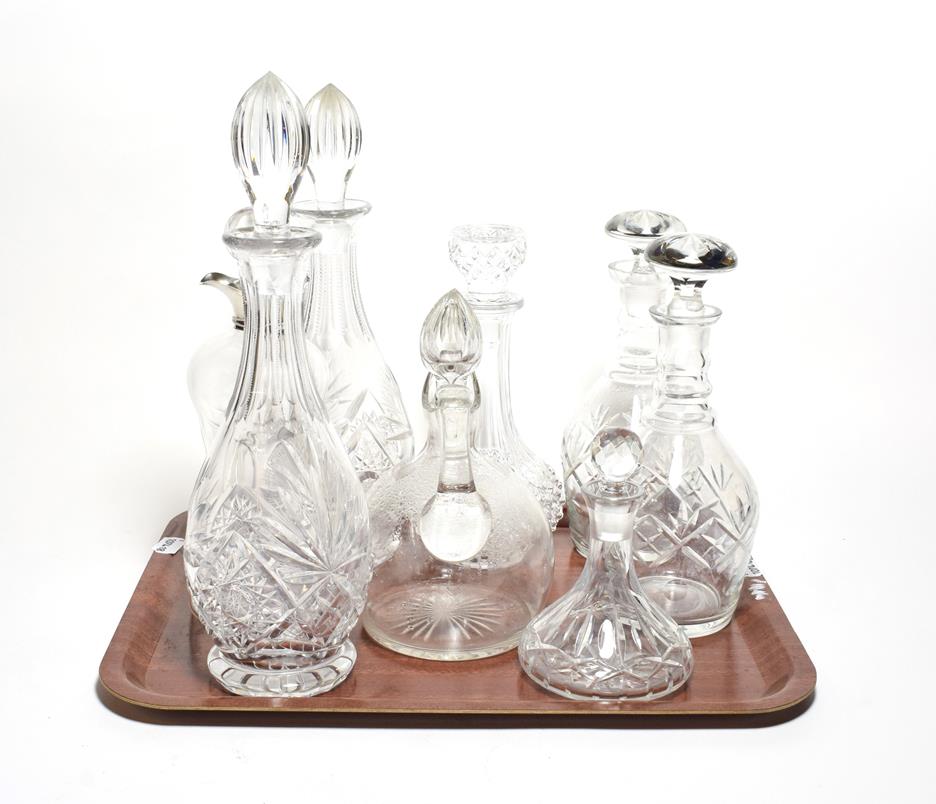 A silver collared decanter, together with two pairs and another three decanters (8)